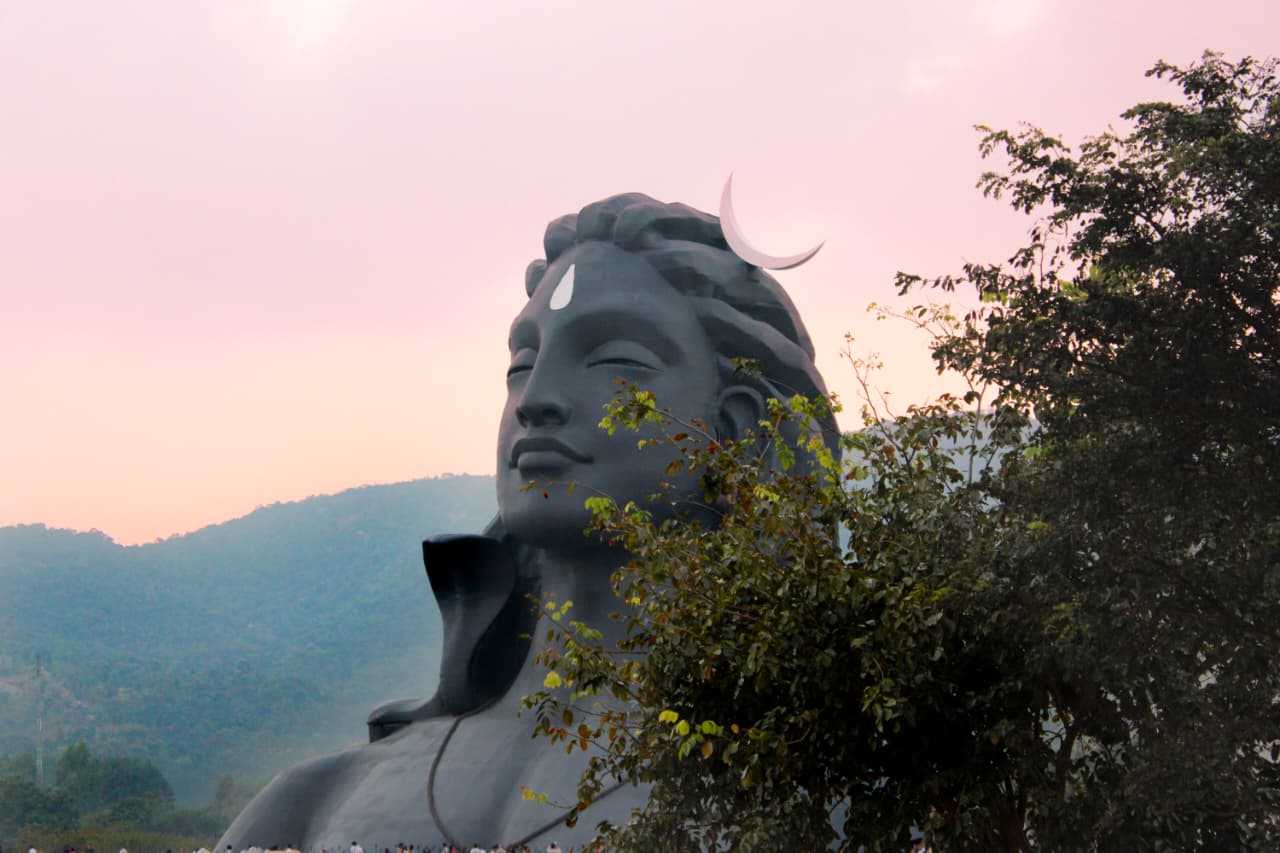 Adiyogi statue surrounded by hills